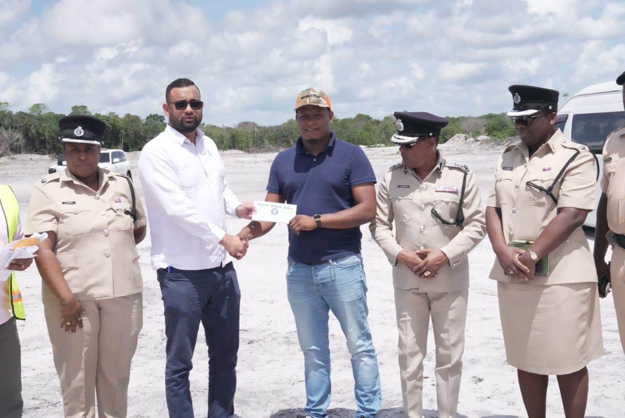 Official contract documents being handed over at the construction site