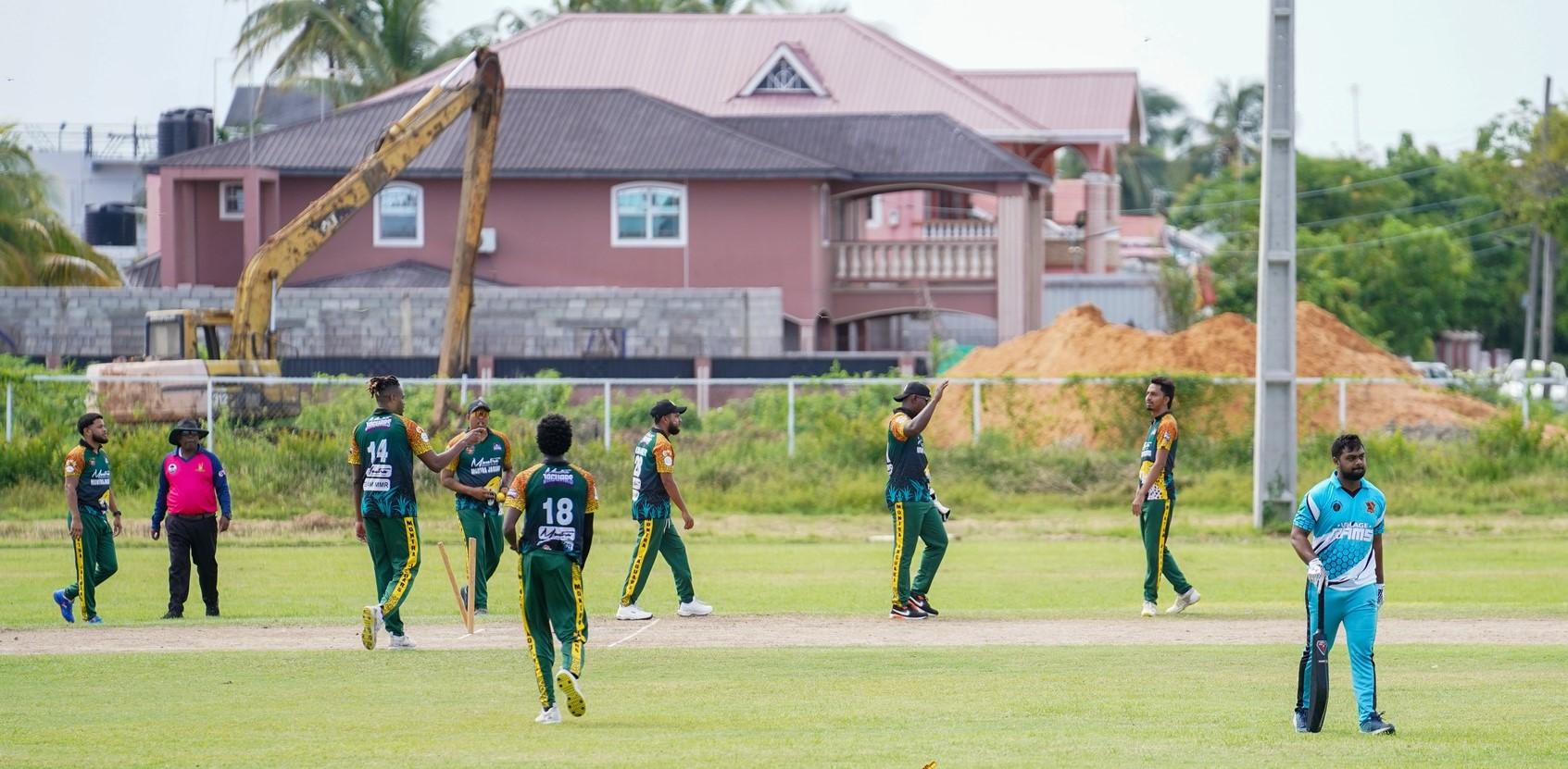 Montra Jaguars celebrate the fall of a wicket against Village Rams.Â