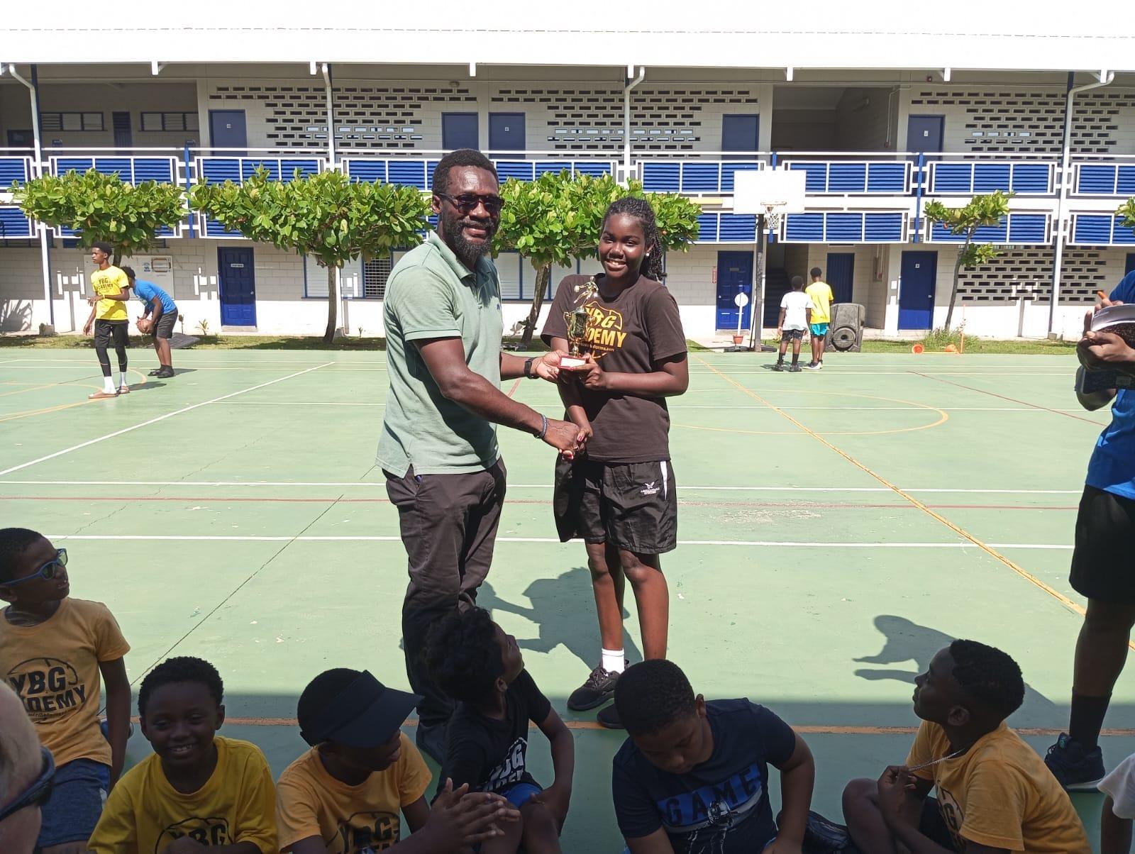YBG’s Co-Director Chris Bowman hands over trophy to Best Female Camper