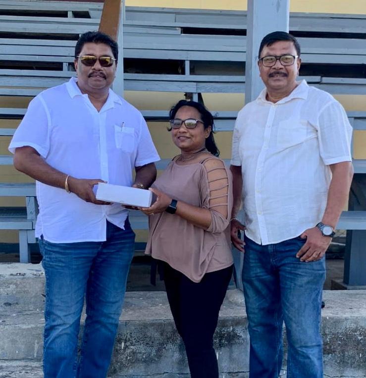 From left to right: Anil Beharry, Galina Hitnarine and Surindradat Beharry at the presentation.