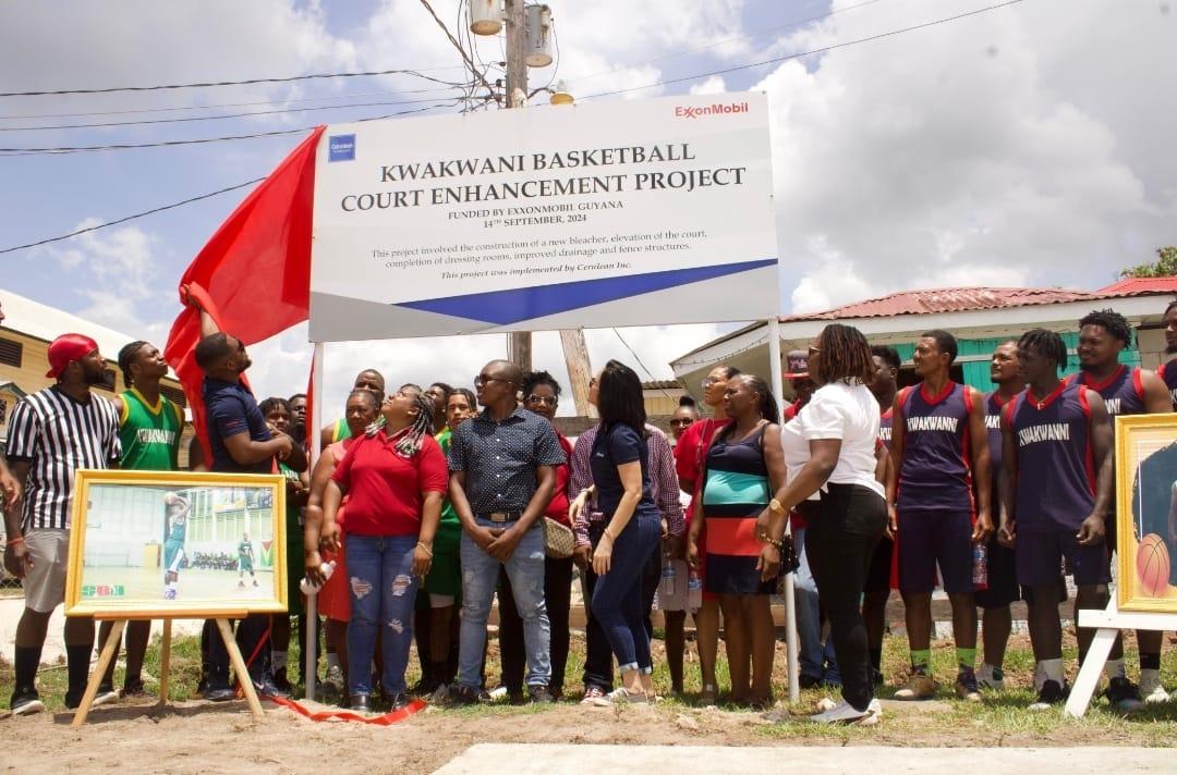 Officials and residents at the Kwakwakni Basketball court enhancement project hand over.