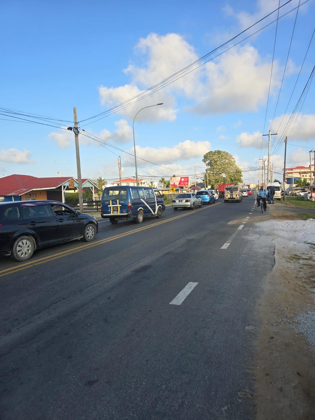 Traffic congestion caused by broken road on the Coldingen road on the railway embankment