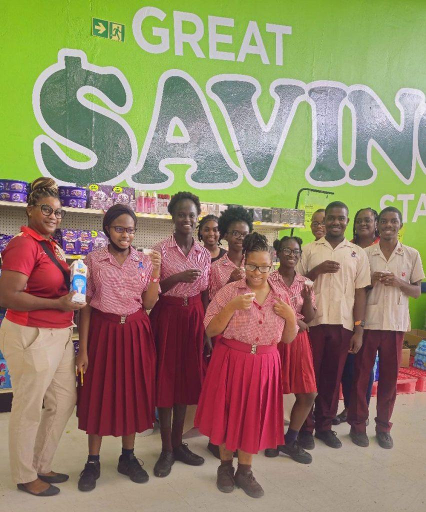 Students in Barbados sampling Savannah milk in a supermarket
