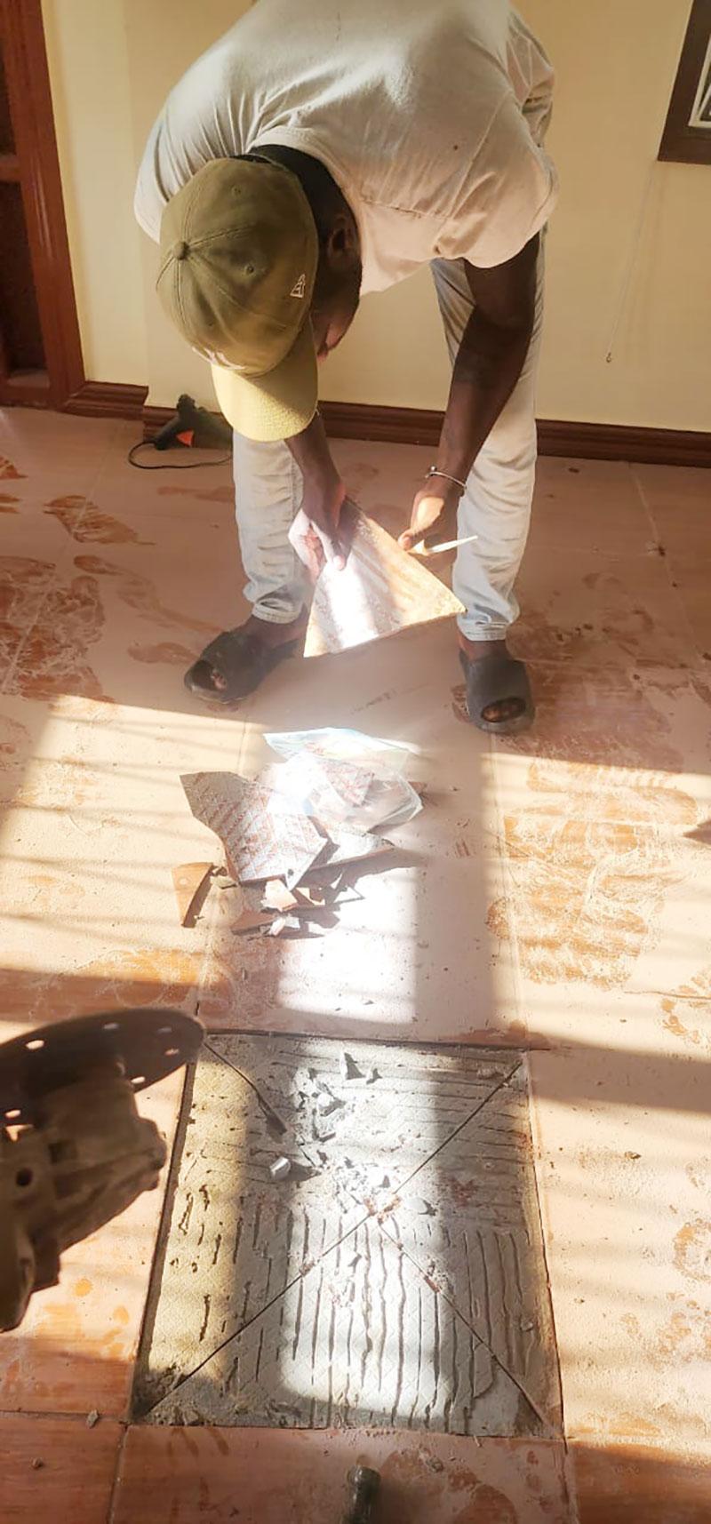 An officer of GGMC collecting samples from an affected home