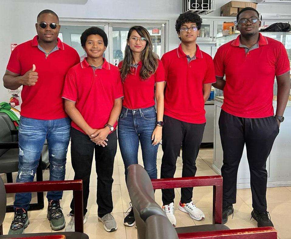 Members of the Guyana Badminton team take a photo as they head to Suriname.